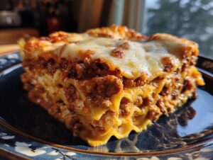 A close-up of a hearty slice of lasagna with cottage cheese, featuring layers of pasta, meat sauce, and melted cheese.