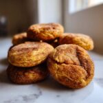 A stack of chewy pumpkin blondies coated in cinnamon sugar, ready to be enjoyed.