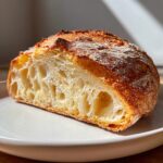 Cross-section showing the open, airy crumb structure of classic homemade ciabatta bread.